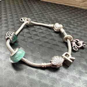PANDORA Silver Bracelet with Green and Pink Accents with six Pandora charms.